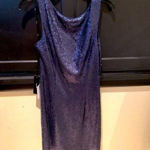 Brand new Navy Blue dress with dropping back.